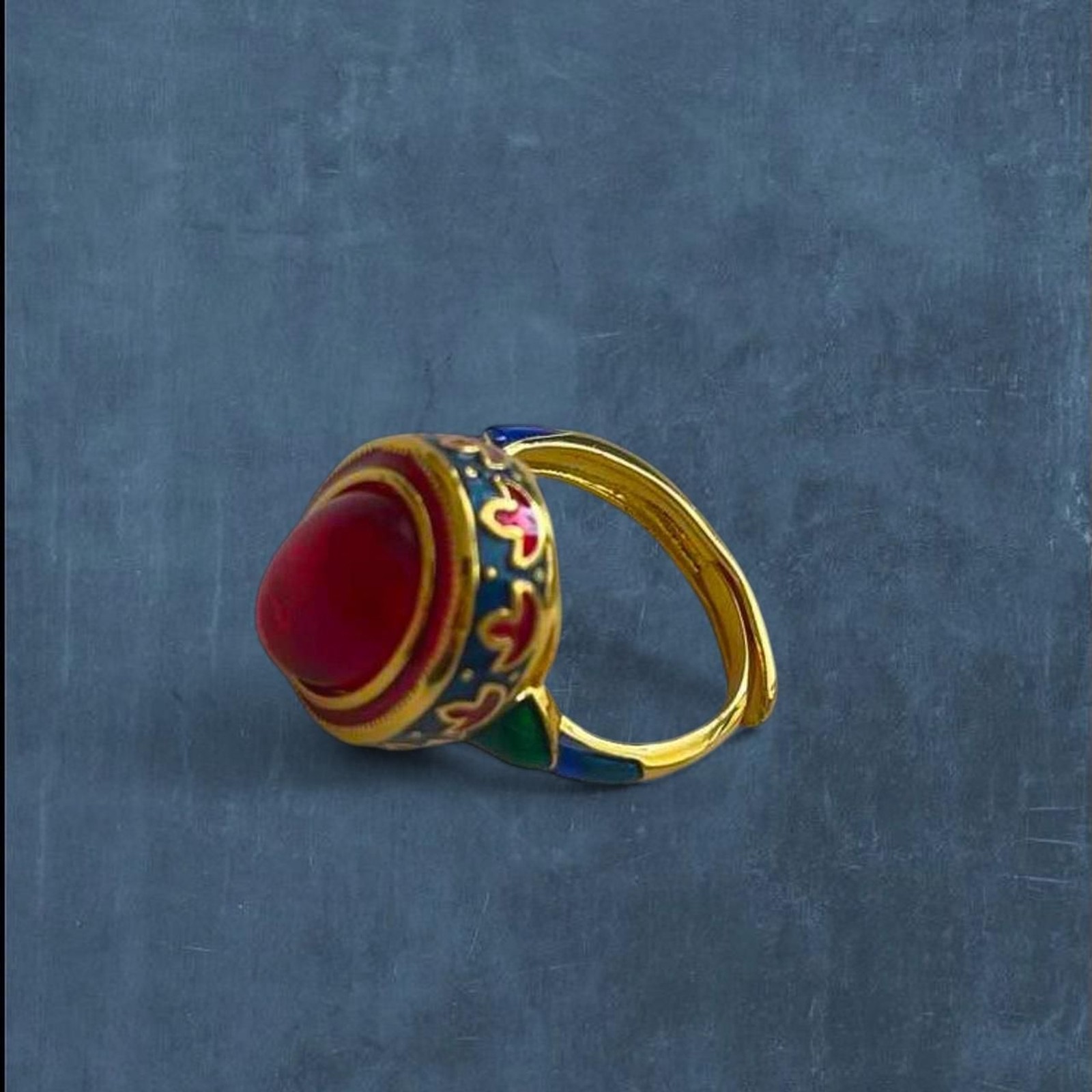 whimsical vintage style chunky red stone ring with blue and gold details