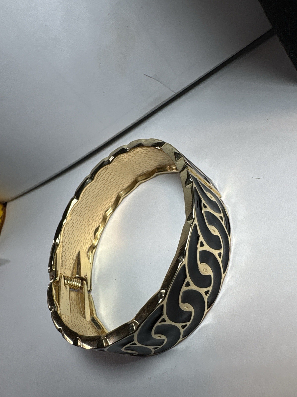 Bold and modern hinged cuff bracelet ,gold-tone with black enamel