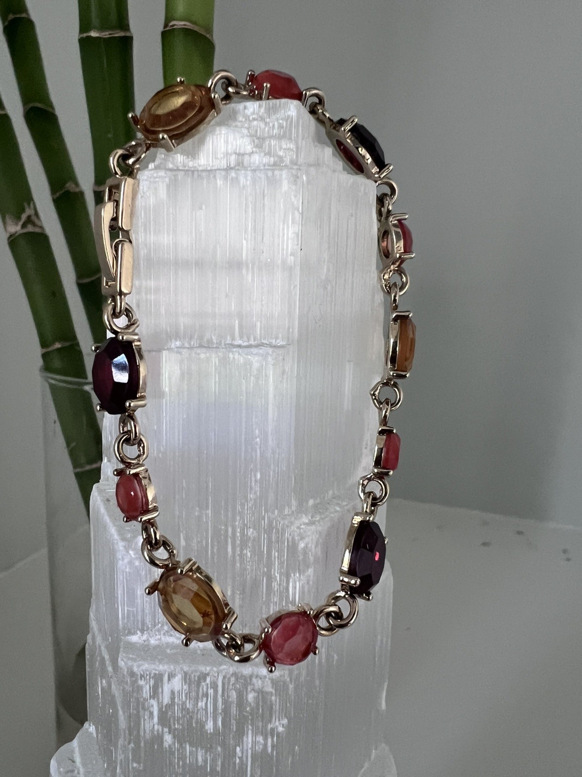 UPBEAT earth tones rhinestone bracelet 7 in length/ fold over clasp/ gold tone