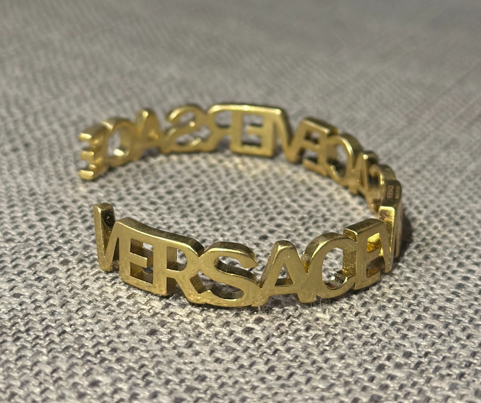 Versace Logo Cuff Bracelet Gold Tone Open Bangle Spellout Designer Luxury