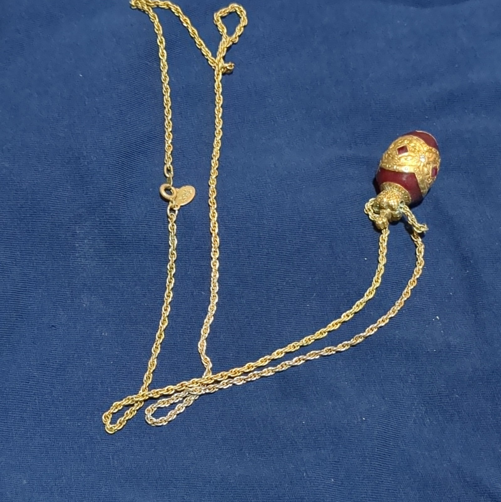 Gold Tone Metal Rope Chain Necklace with Red Egg-Shaped Pendant