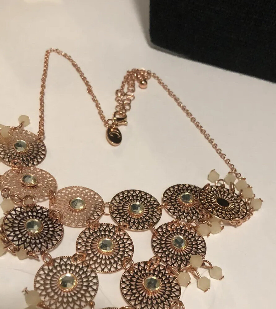 Charming Charlie’s pink rose tone filagree cha cha disc statement necklace