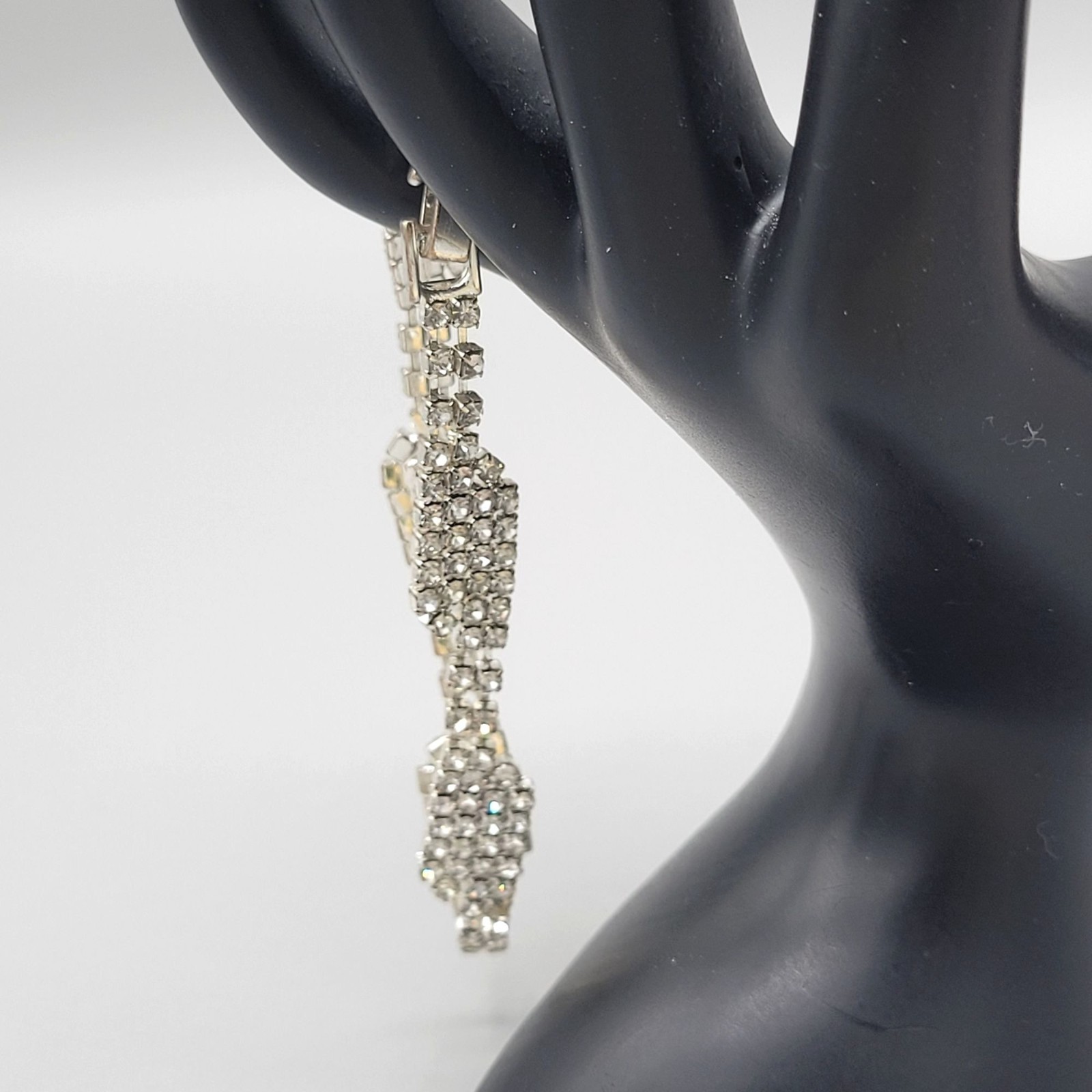 Silver Tone Bracelet With Cascading Multi Row Rhinestones Fold Over Clasp