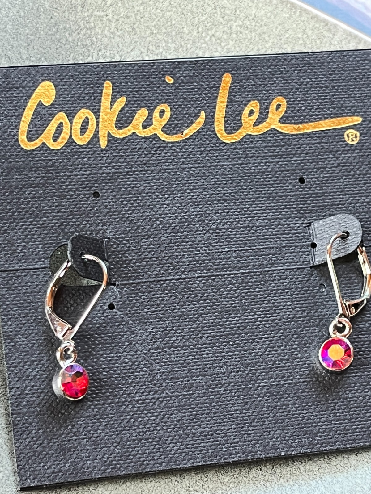 Cookie Lee Small Round Red Aurora Borealis Rhinestone in Silvertone Frame Dangle