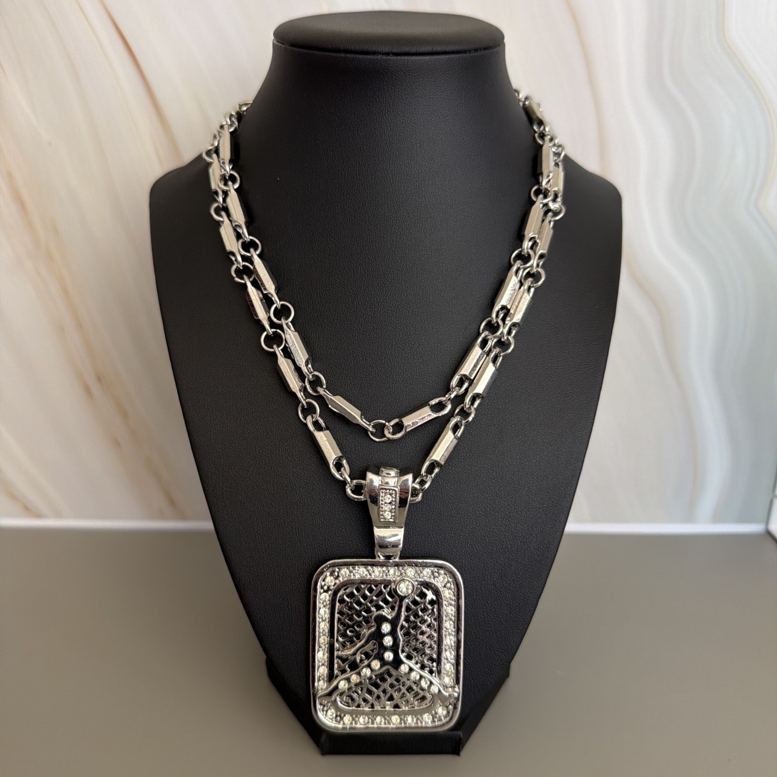 Jordan Silver Tone CZ Studded Pendant With 34” Rope Chain