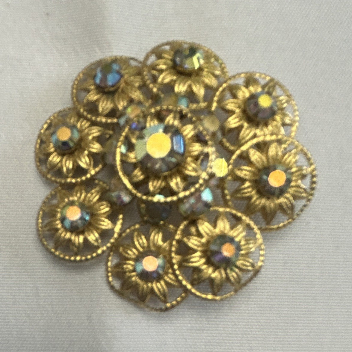 Gold Tone Metal Flower Brooch Pin Clear Round Rhinestones Prong Set 1.25 in