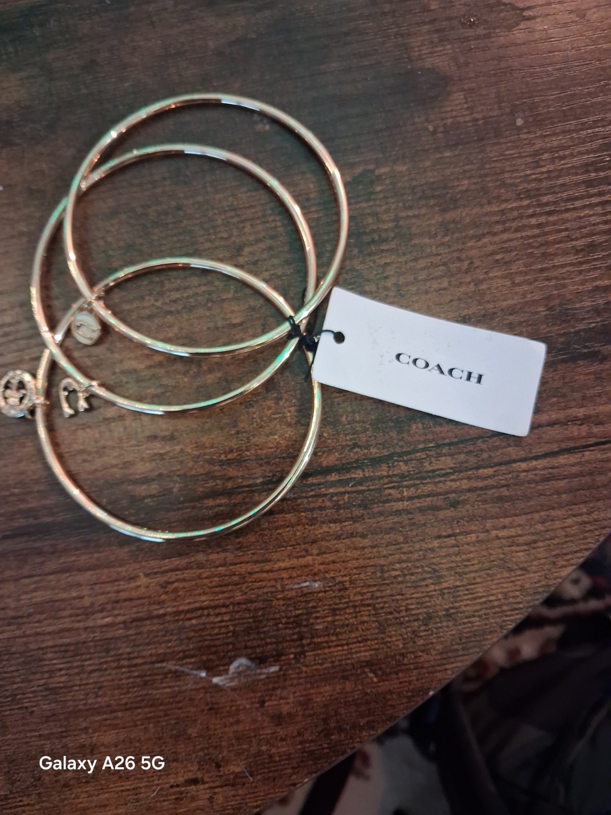 Coach NWT Gold Tone Stackable Bangle Bracelet Set, 3pc Logo With Dangle Charms