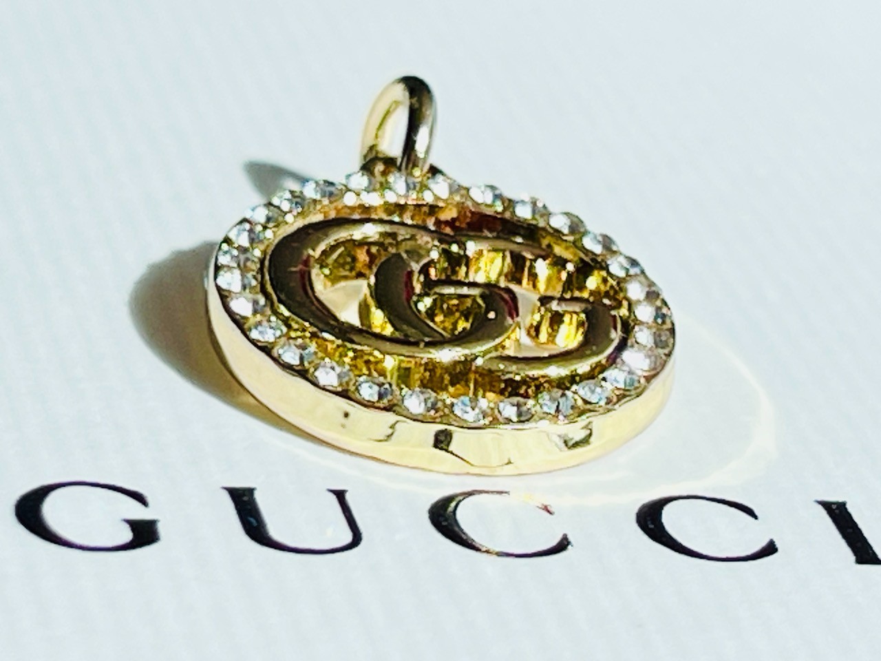 One Gucci Pendant rinestones stamped