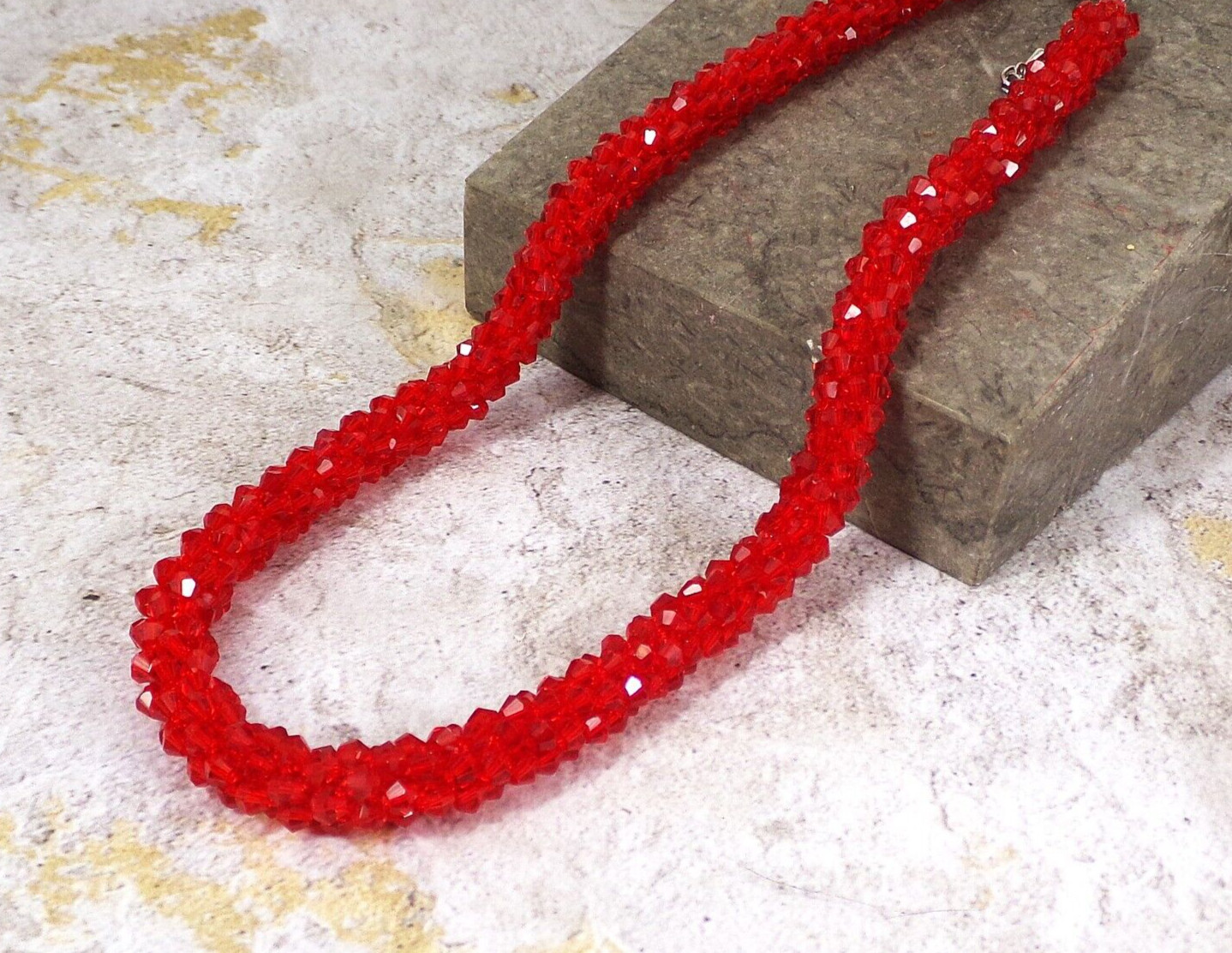 Red glass beaded necklace in a sparkling thick cluster beaded rope design New