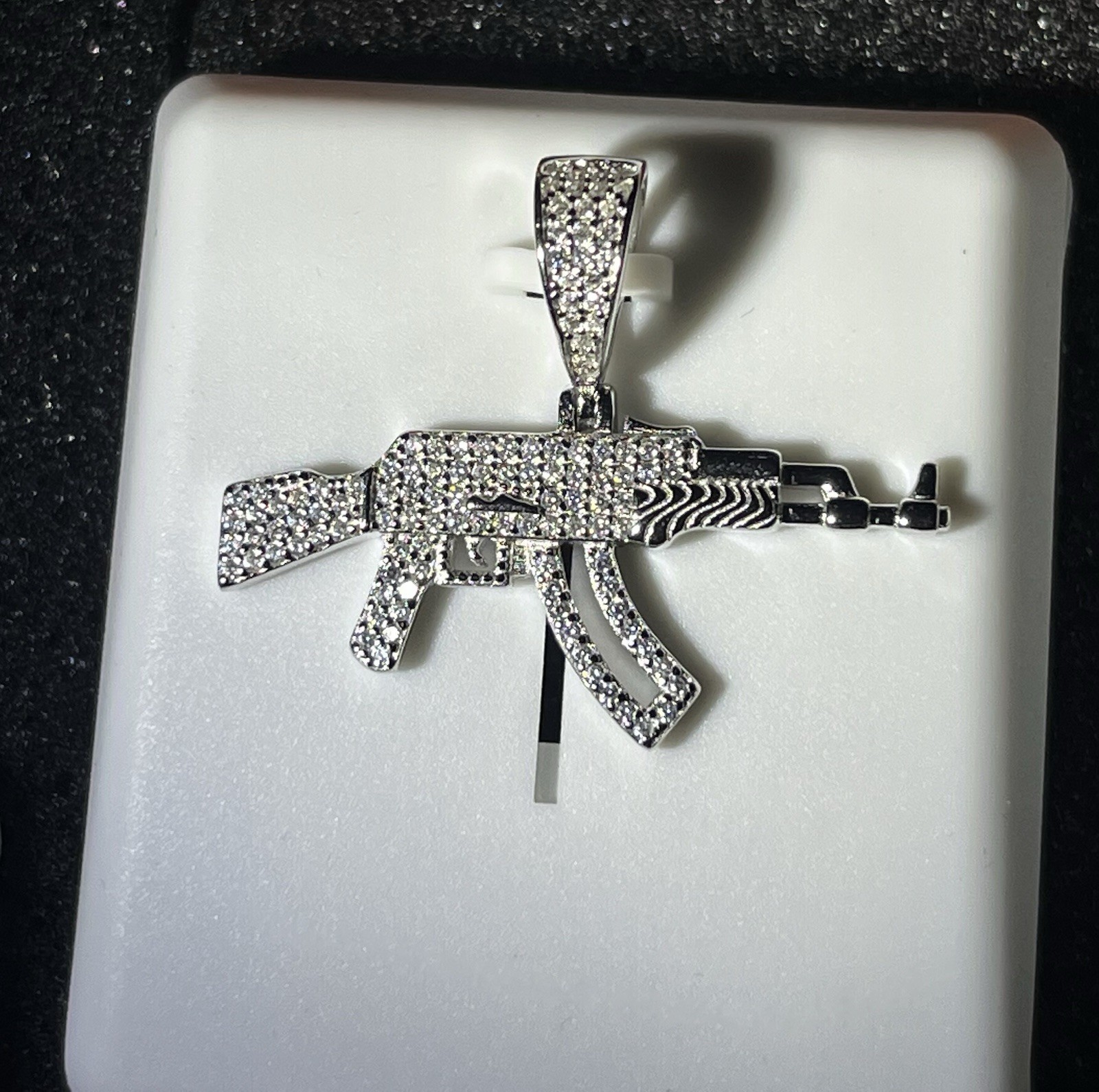 Silver Gun-Shaped Pendant with mossinate