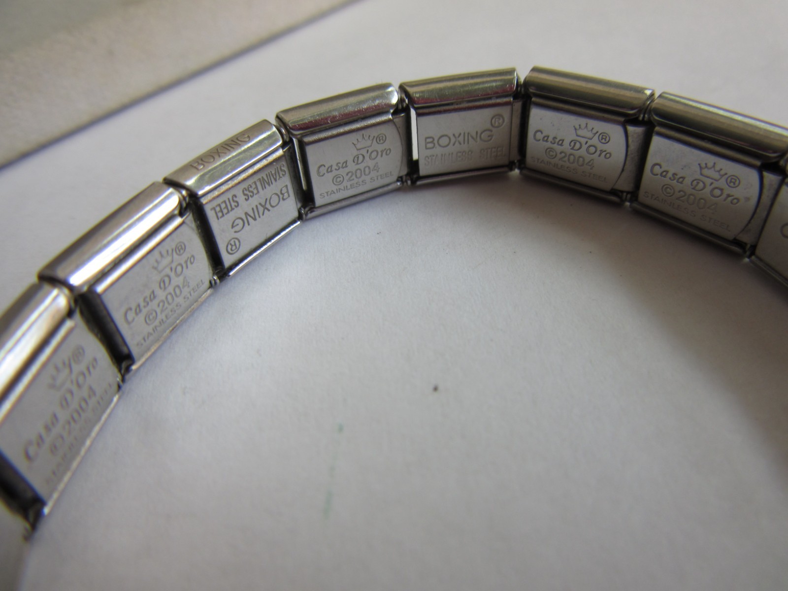 Casa D’Oro stainless charm bracelet with 8 charms