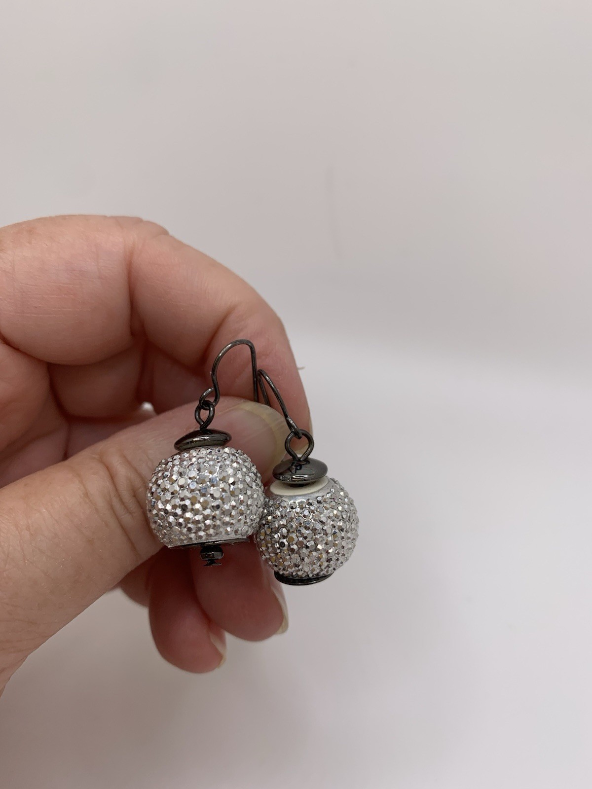 Dangle fishhook earring with pave covered sparkly spherical bead