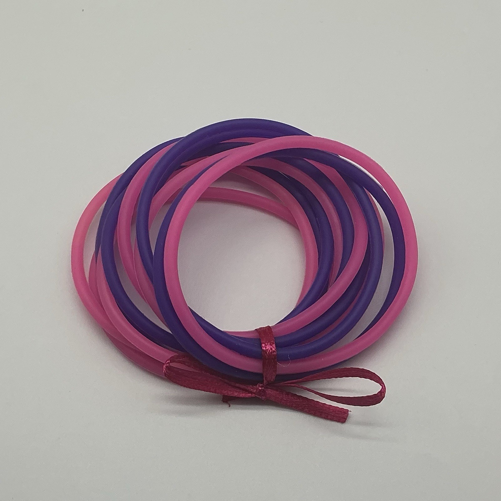 Set Of 12 Pink And Purple Jelly Bracelets