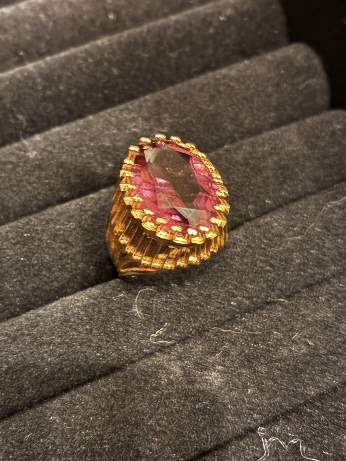yellow gold cocktail ring, large red purple stone in prong setting 7.5-8.0