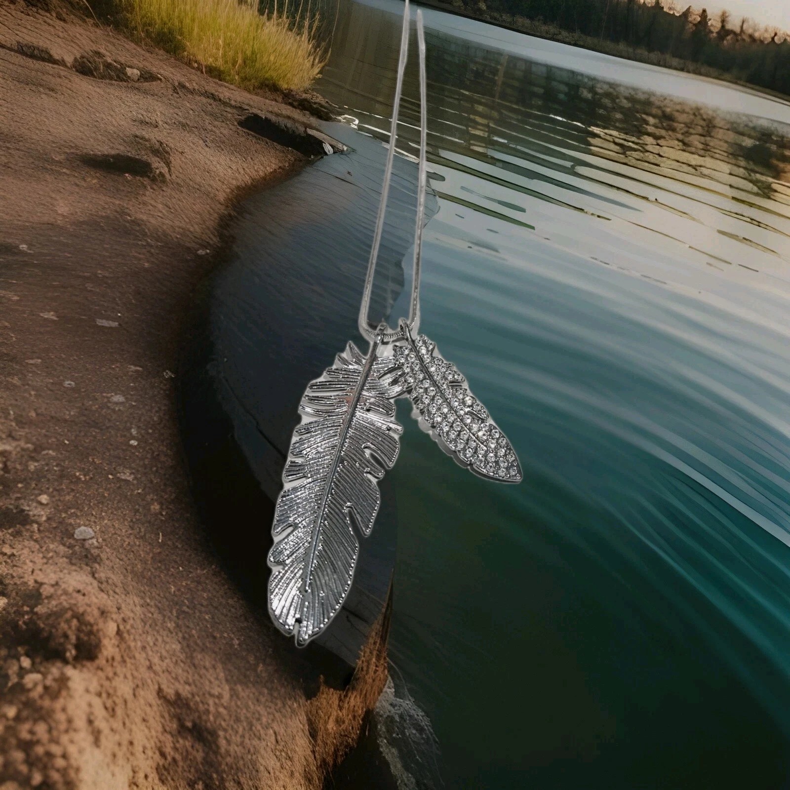 Silvery Necklace with 2 Feather-Shaped Pendants. One has Synthetic Zircon Gems