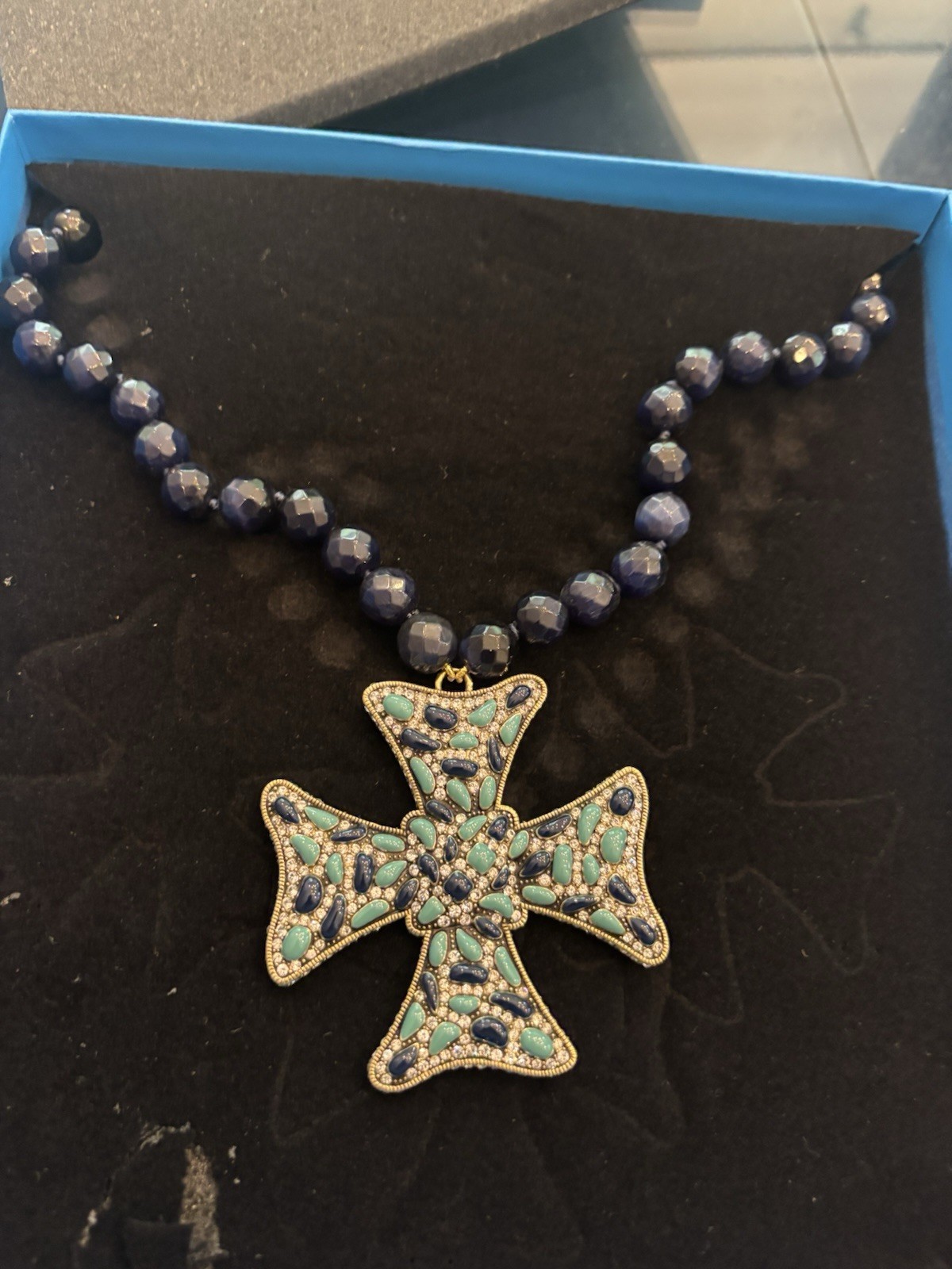 Heidi Daus Aqua Cross necklace with navy blue bead chain in box