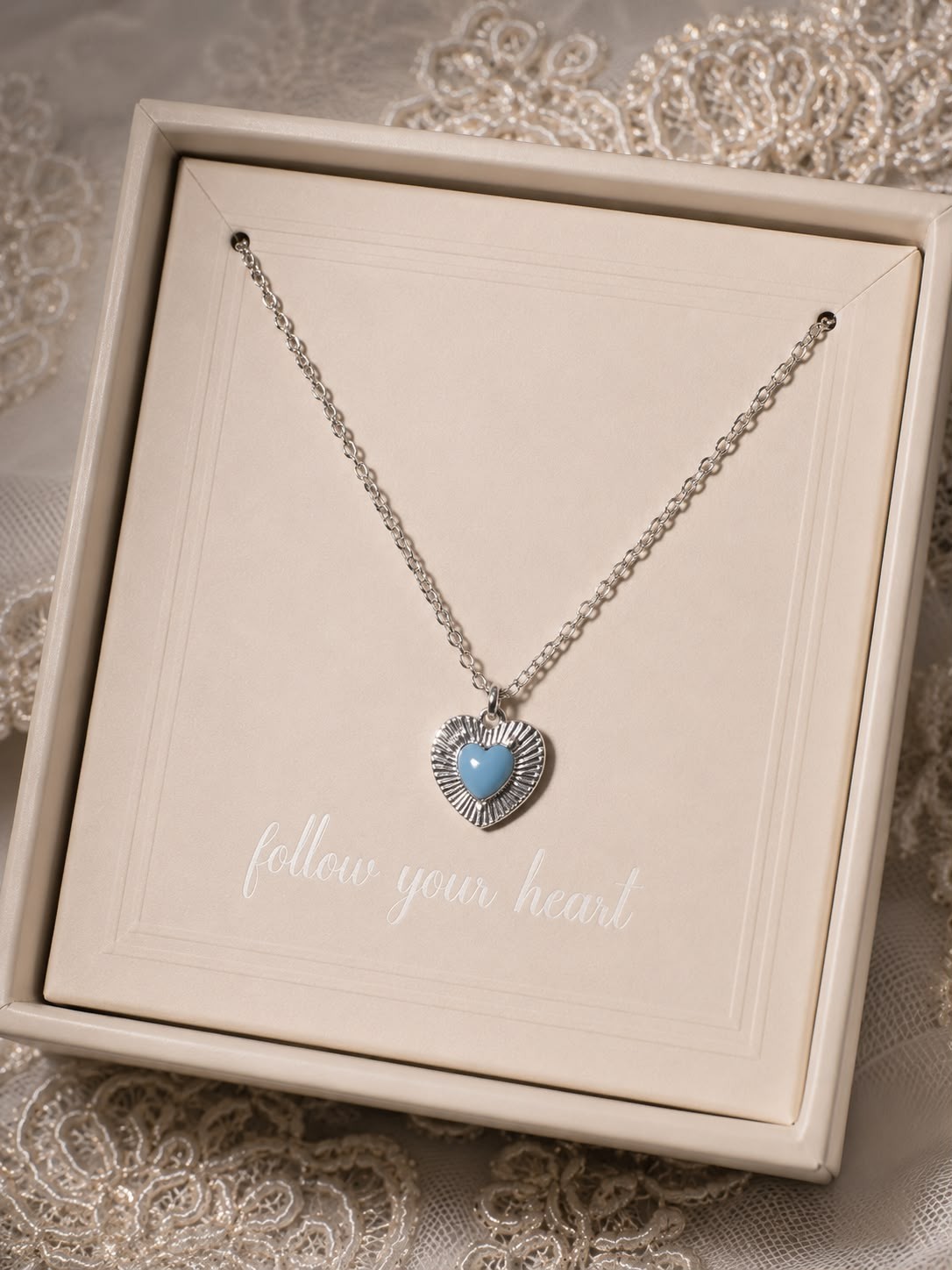 A smooth, rust-resistant silver chain featuring an elegant and attractive blue h