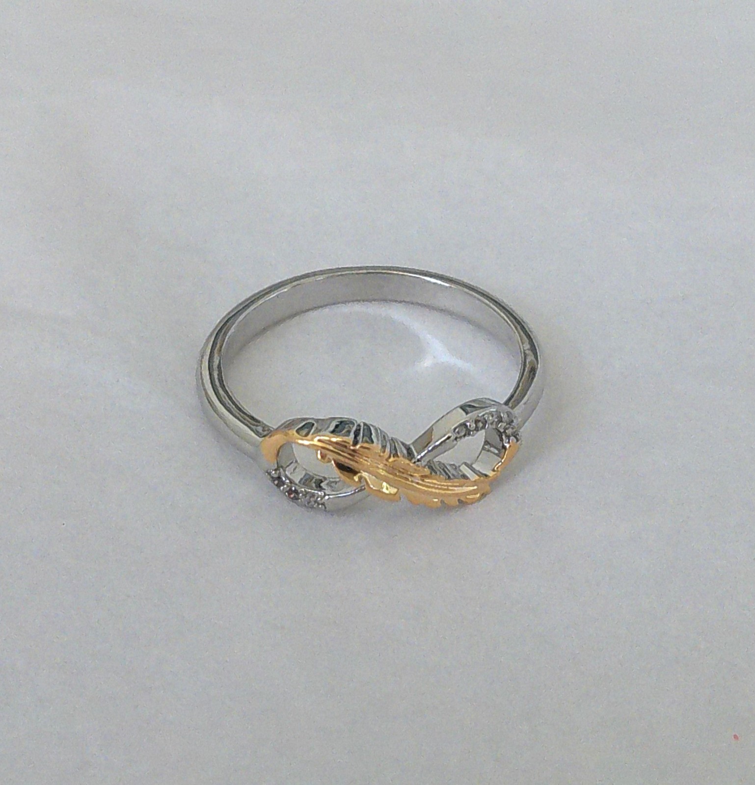 New Silvertone Eternal Infinity Loop with Goldtone Feather Accent Ring Size 7.75