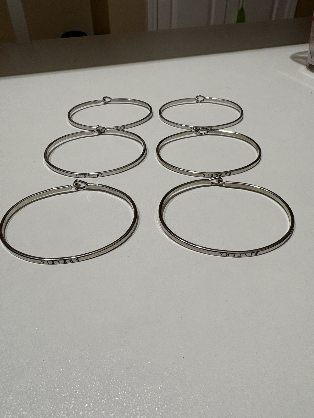 2 Silver Stainless Steel Bangle Bracelets Lot Stamped “Sisters”