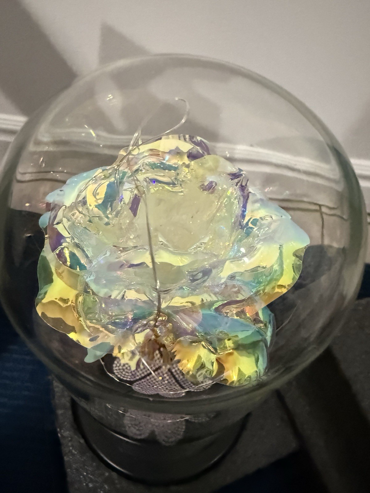 artificial “galaxy” or “eternal” rose in a glass dome with LED lights