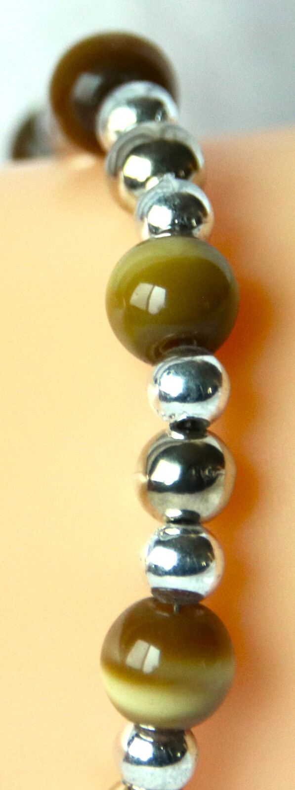 Bracelet of Brown Cat’s Eye Glass with silver colored beads, toggle closure