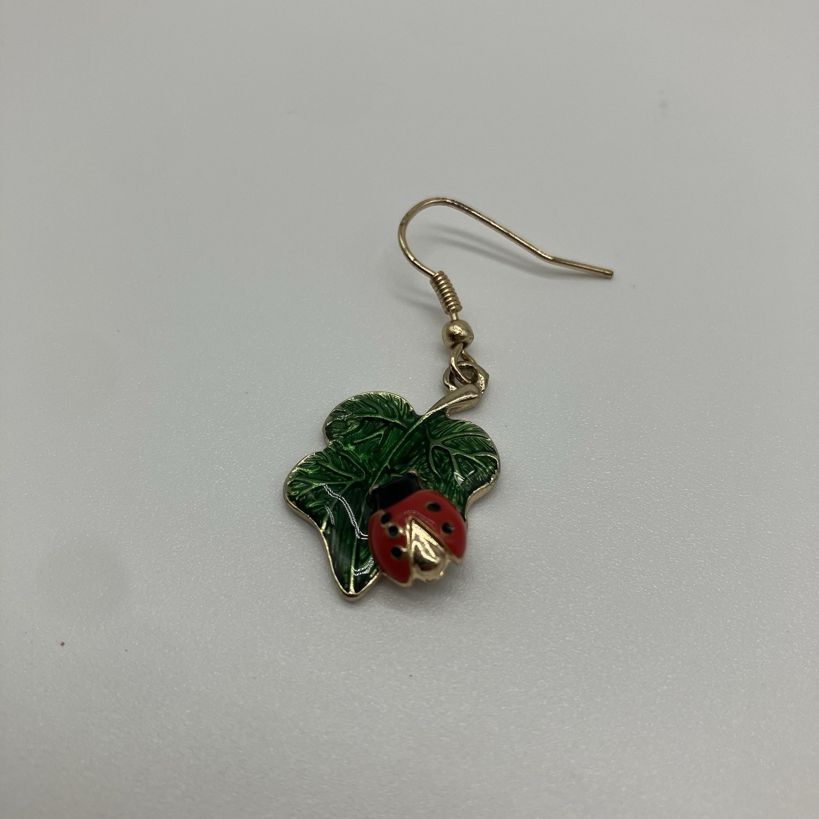 Leaf Earrings with Red Ladybug in a Green Shiny Enamel in gold plating