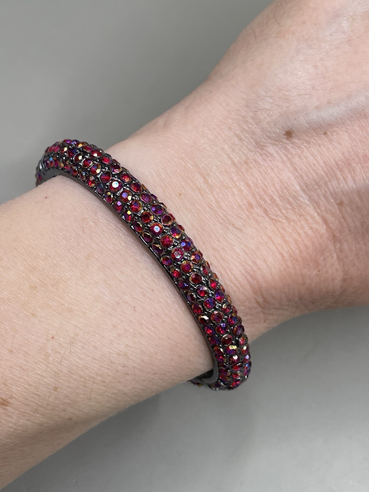 Nine West Gun Metal Sparkle Red Aurora Borealis rhinestones 6.9” Bangle Bracelet
