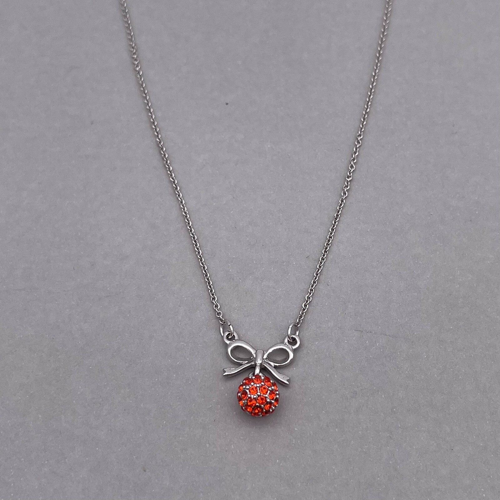 Clue Rhinestone Ball and Bow Link Chain Necklace Silver Tone 15 to 17 in