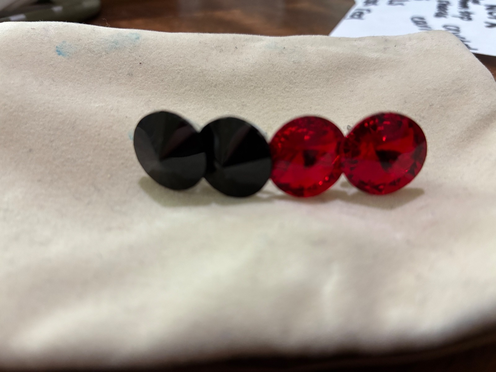 crystal earrings, one red pair and one black pair