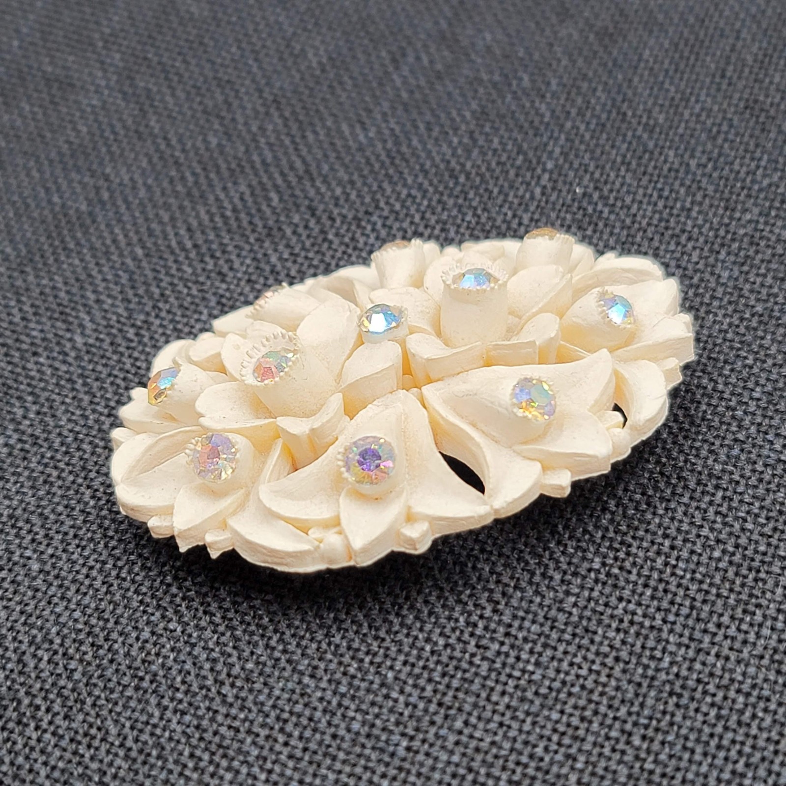 White Molded Flower Brooch Pin Aurora Borealis Rhinestone Oval Early Plastic 2.5