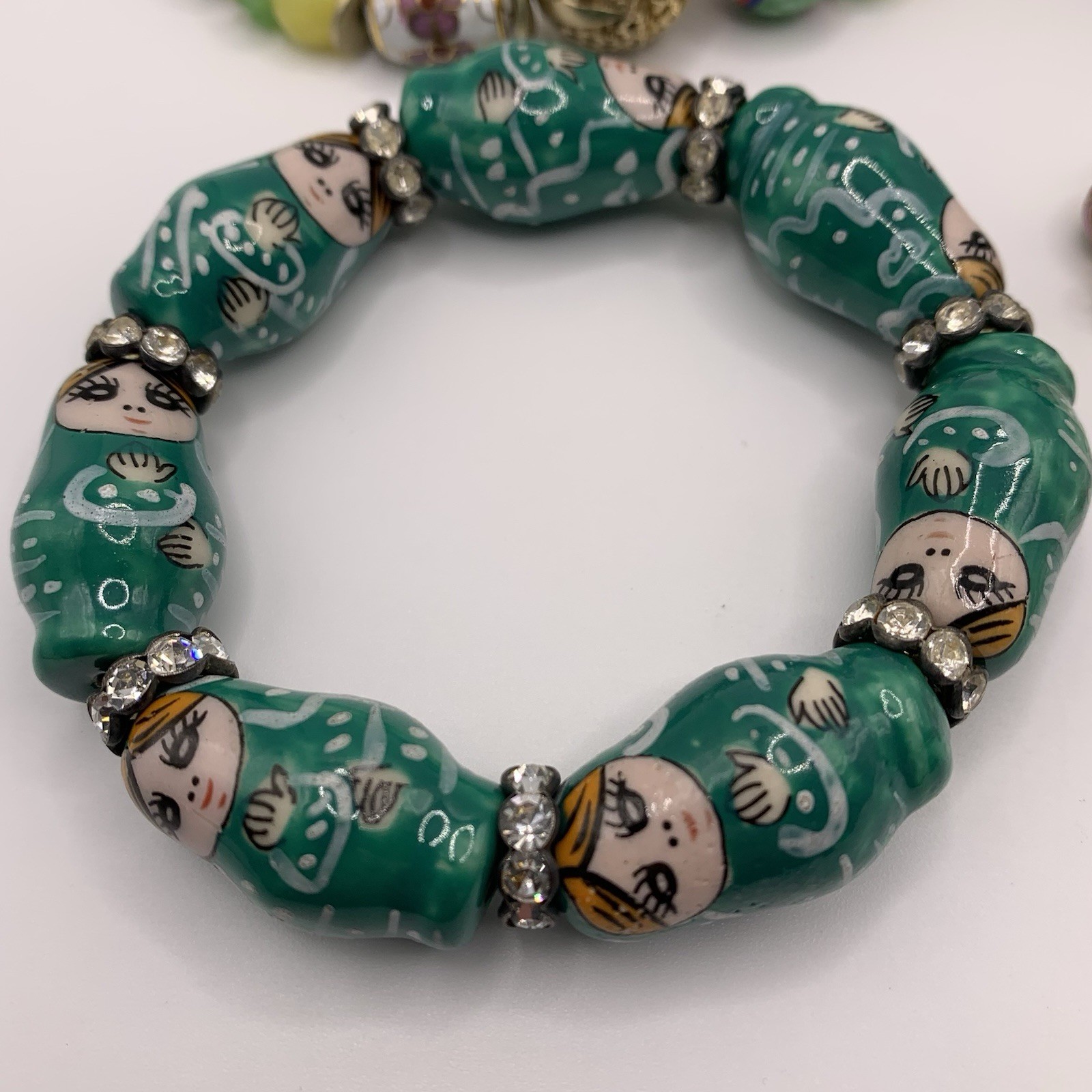 Lot of Four Beaded Bracelets Green Gold Tone Stretch Cloisonné Matryoshka
