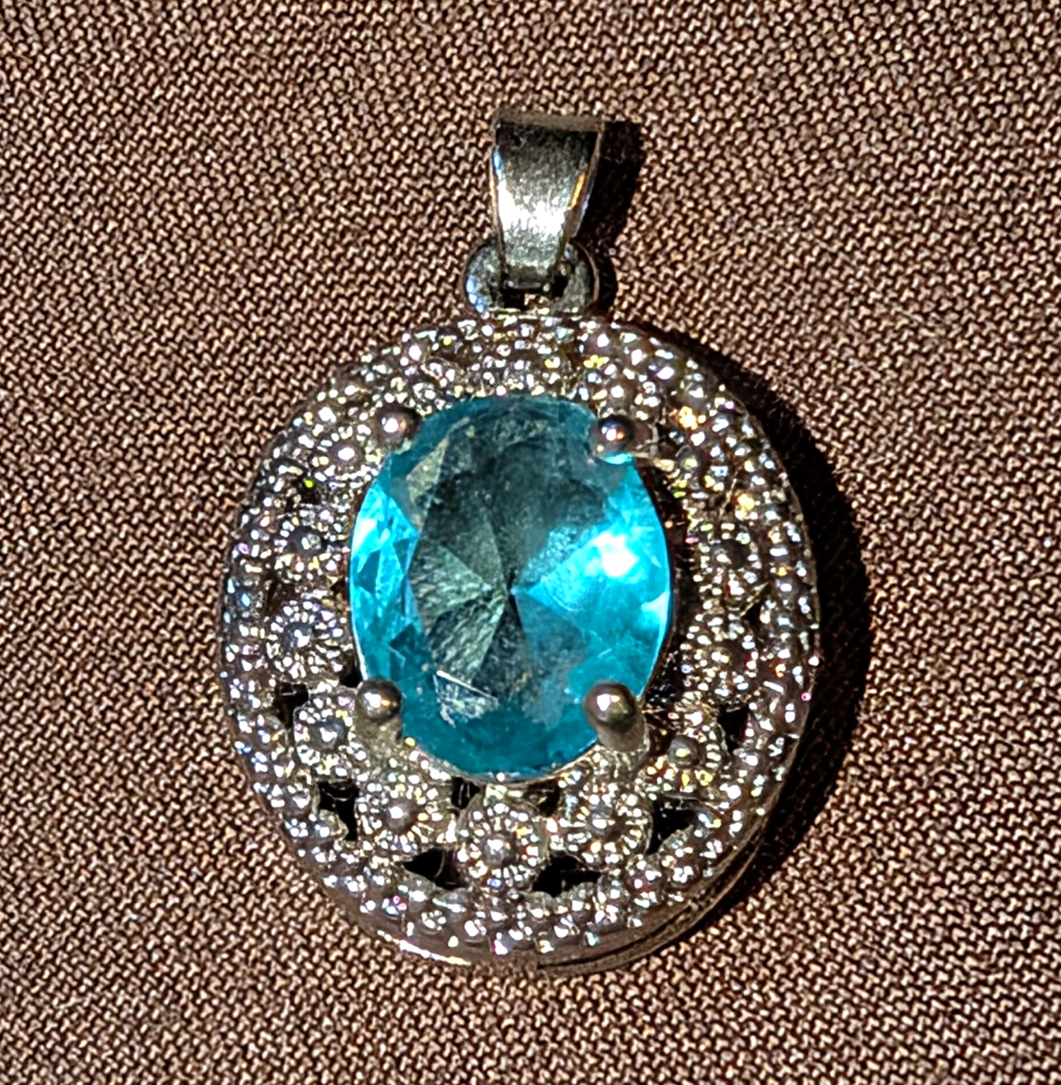Silver Tone Round Charm Pendant, Oval Blue Stone, Prong Setting