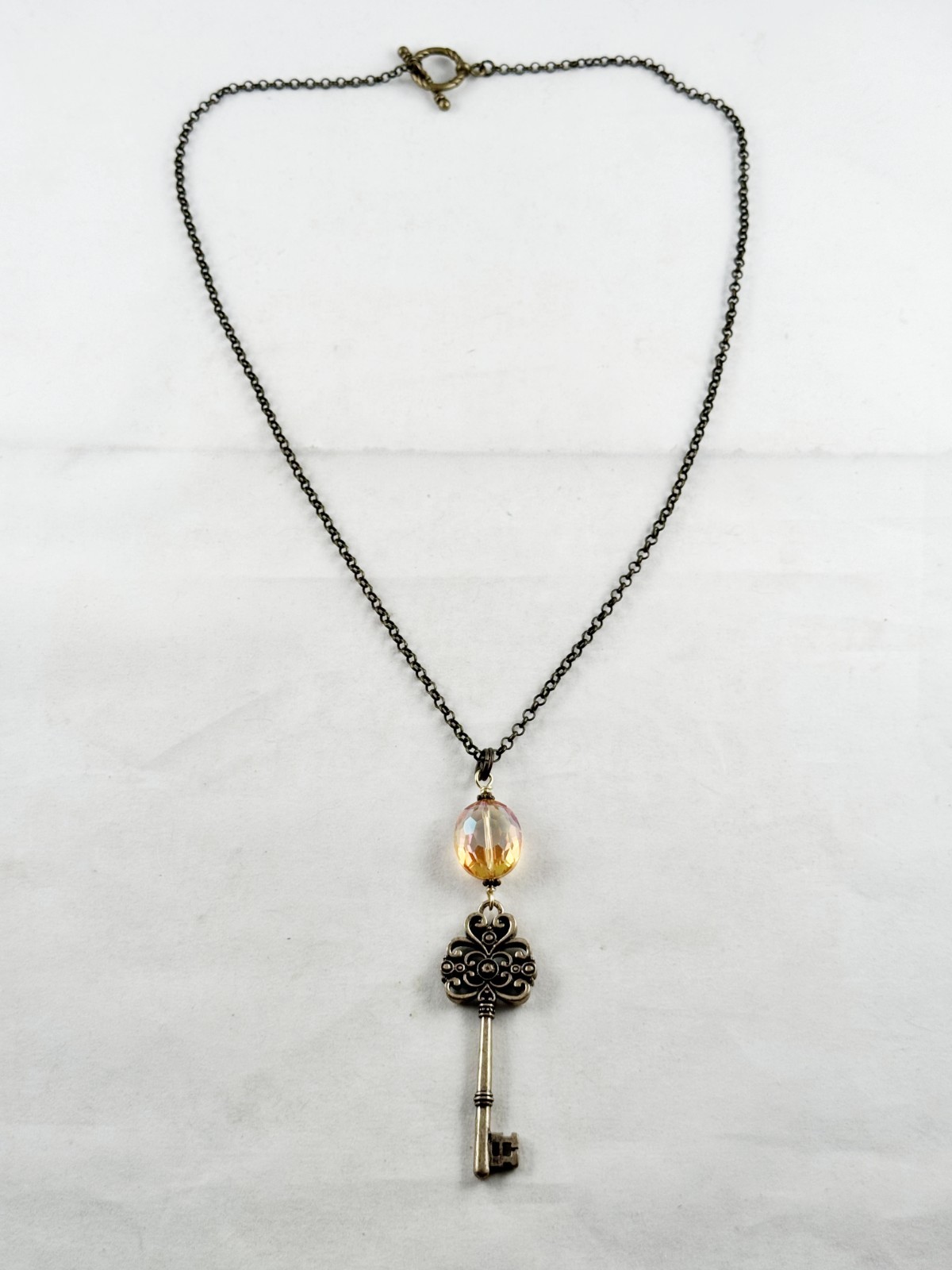 Antique bronze color chain necklace with Amber crystal and ornate key