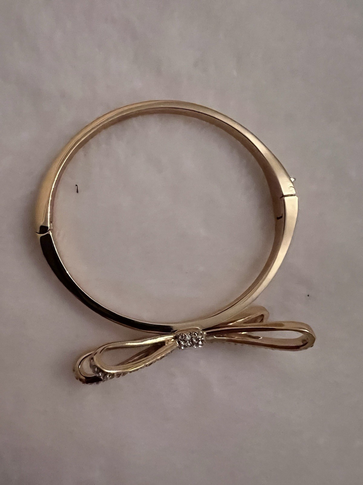 kate spade new york Gold Tone Bow Bangle Bracelet w/ Pavé White Crystal