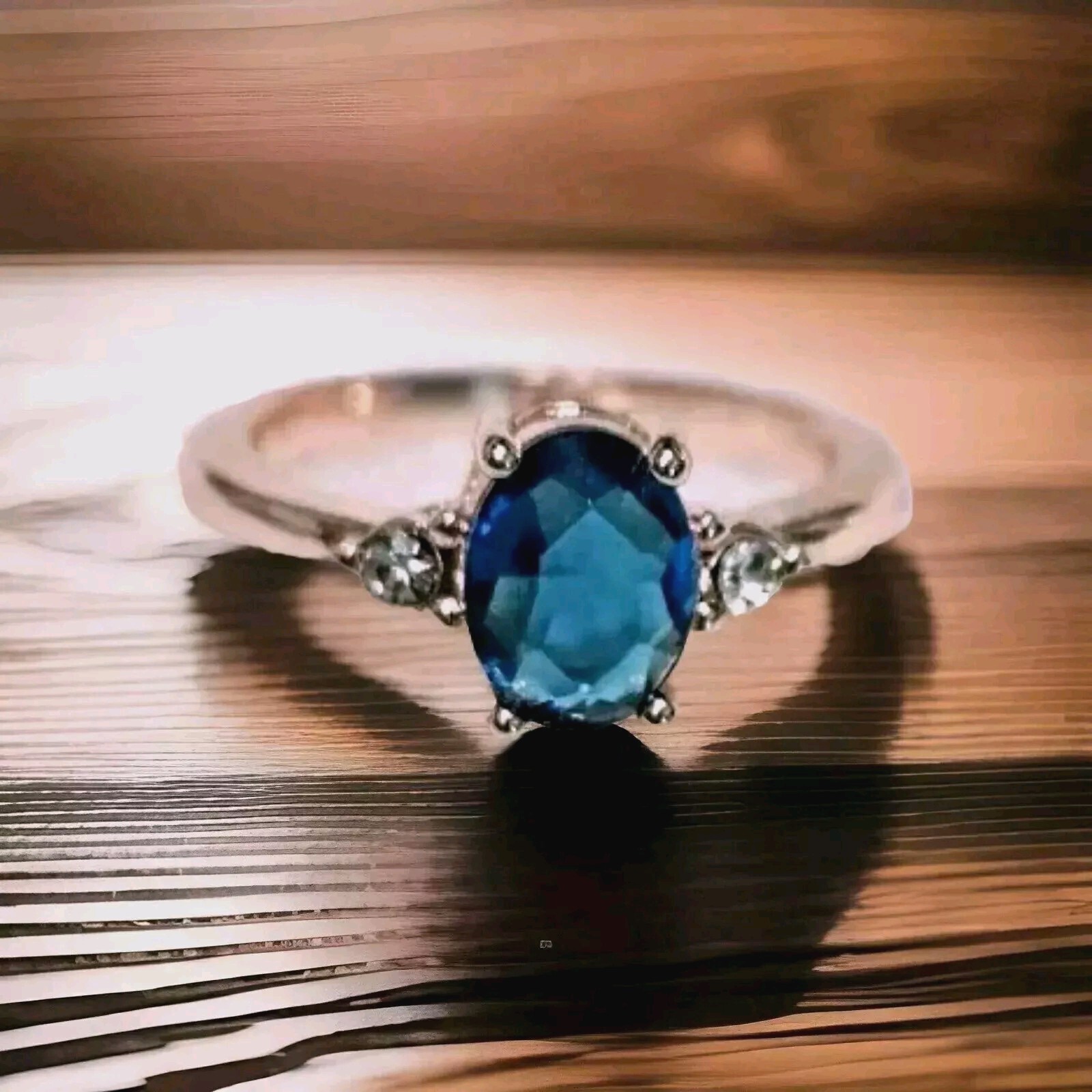 14k Gold Plated Ring with a Synthetic Blue Zircon Stone and Side CZ Stones.