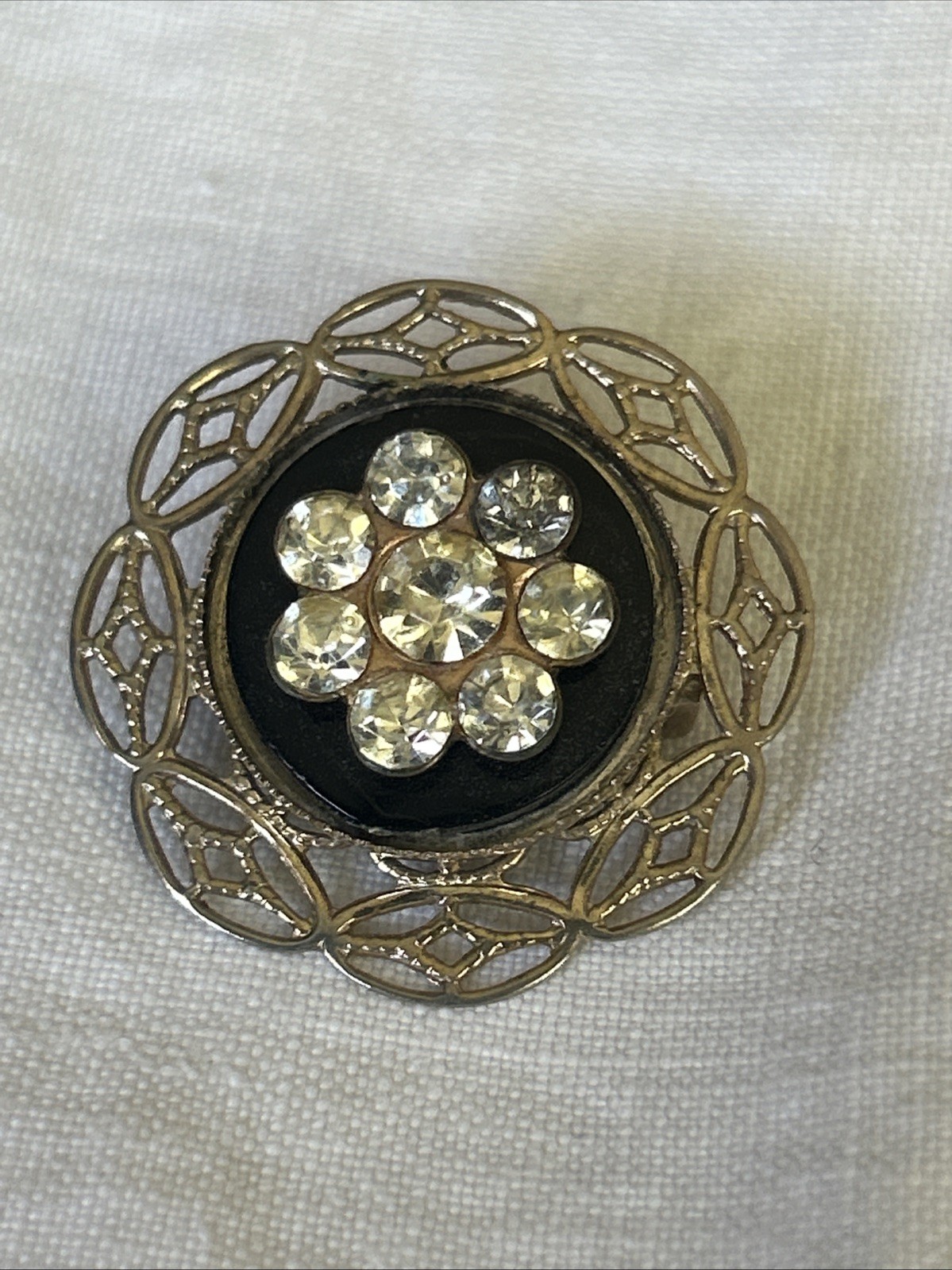 Petite Brooch Rhinestone Pin On Delicate Gold Tone Pressed Tin Filagree