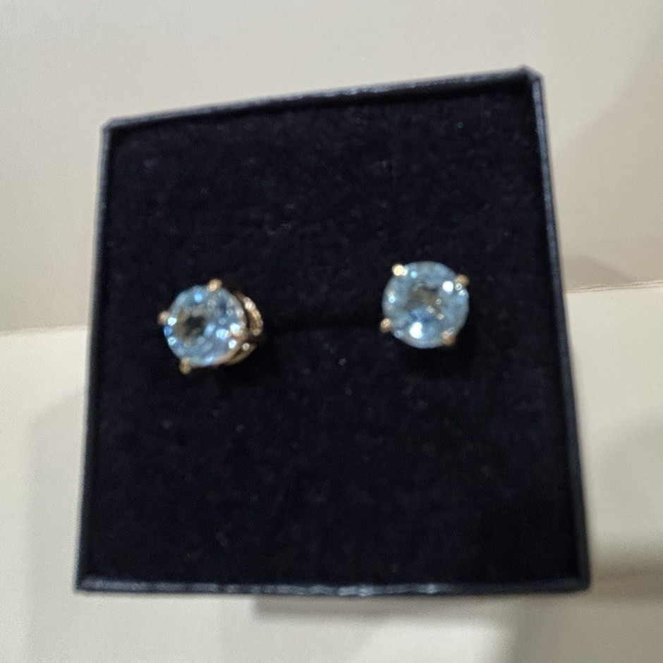 Beautiful Woman’s 18k yellow gold over Sterling Silver Blue Topaz round studs