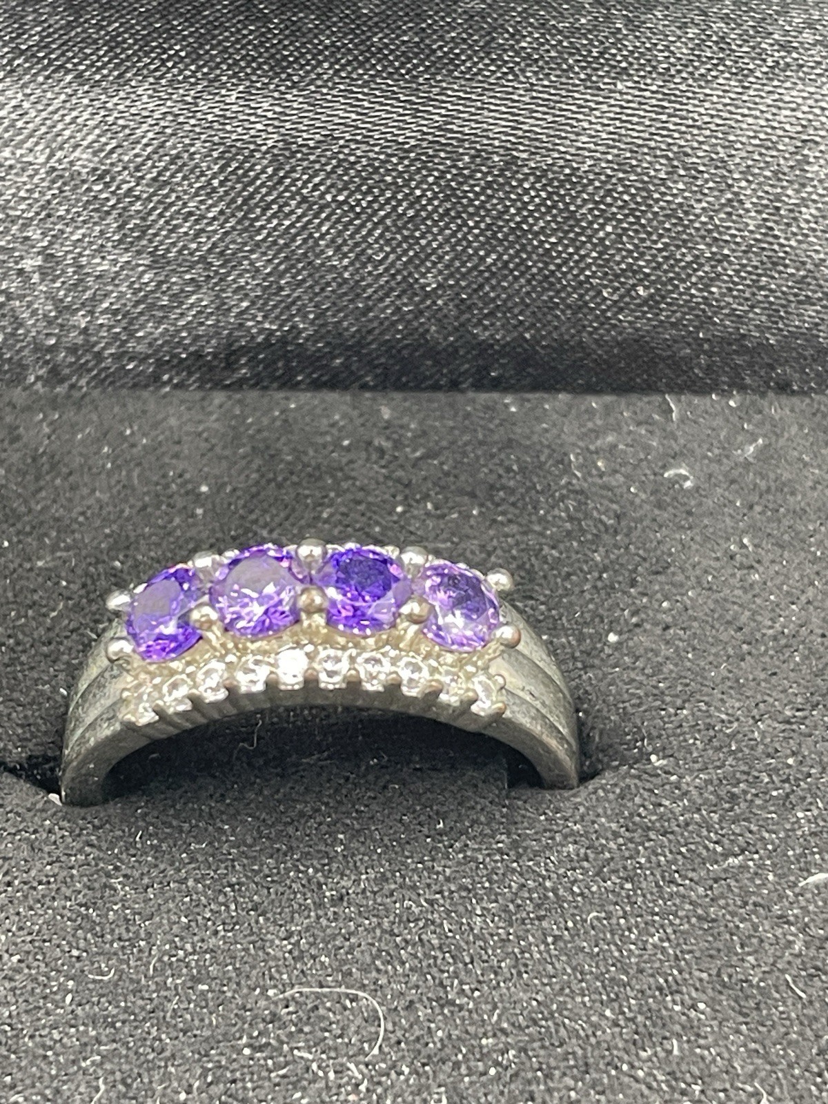 Silver ring with unknown 4 purple stones 10 tiny clear chip stones size 9