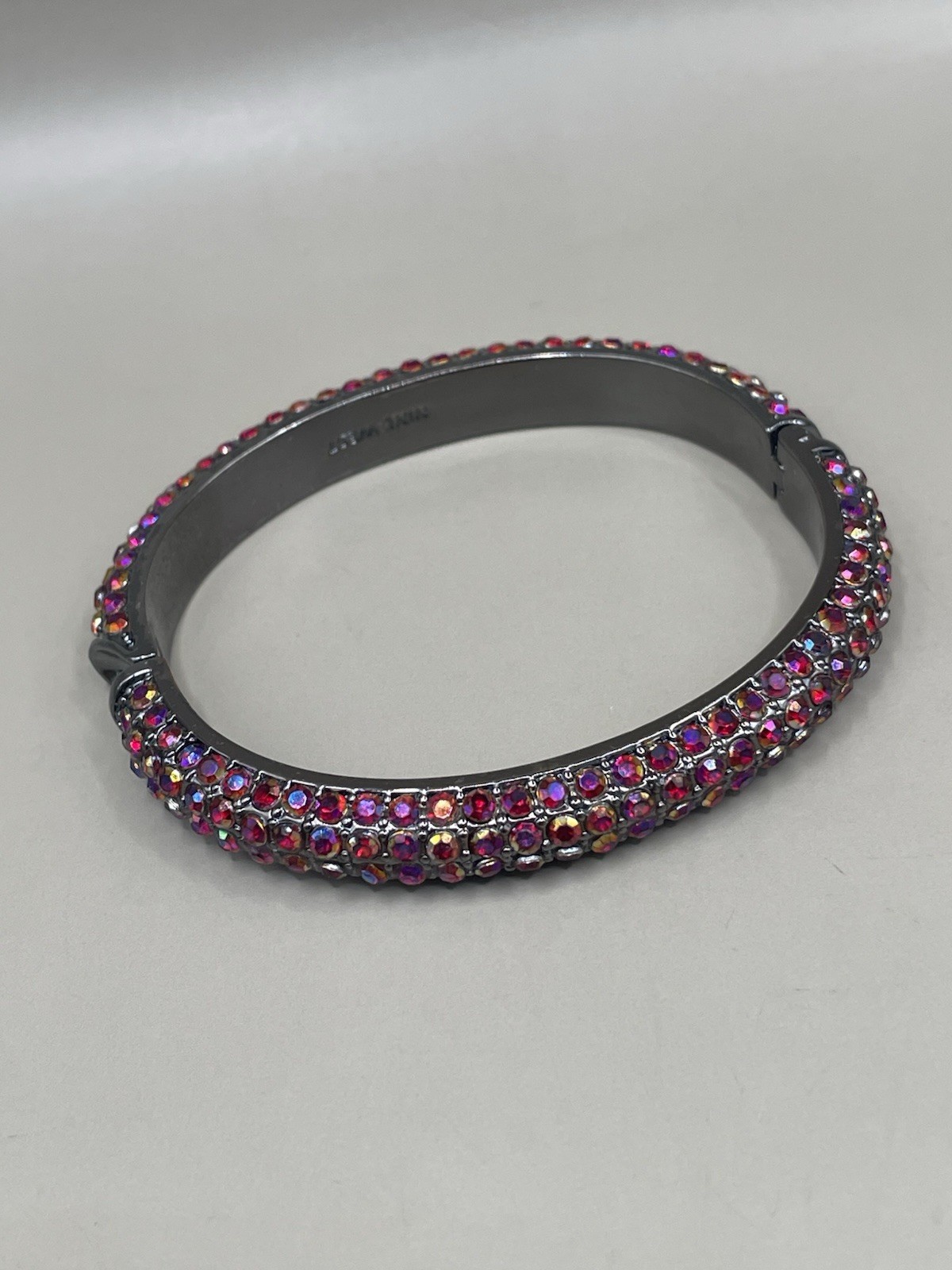Nine West Gun Metal Sparkle Red Aurora Borealis rhinestones 6.9” Bangle Bracelet