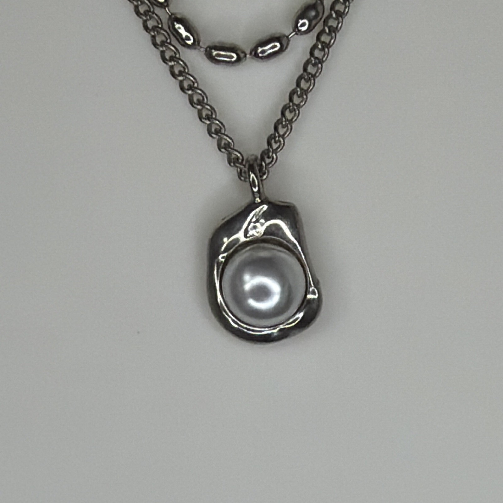 Double strand, gunmetal necklace with Central Pearl pending
