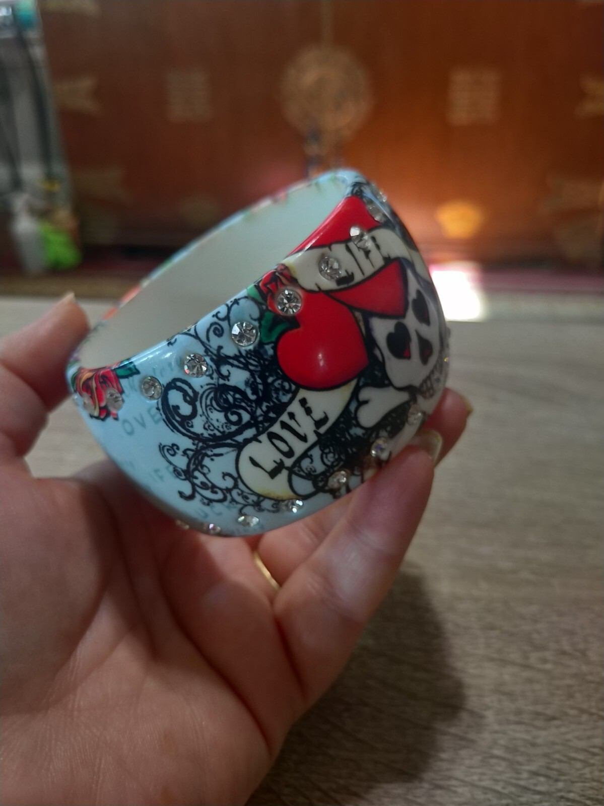 Plastic, rhinestone bangle bracelet. Love life luck skeleton skull tattoo