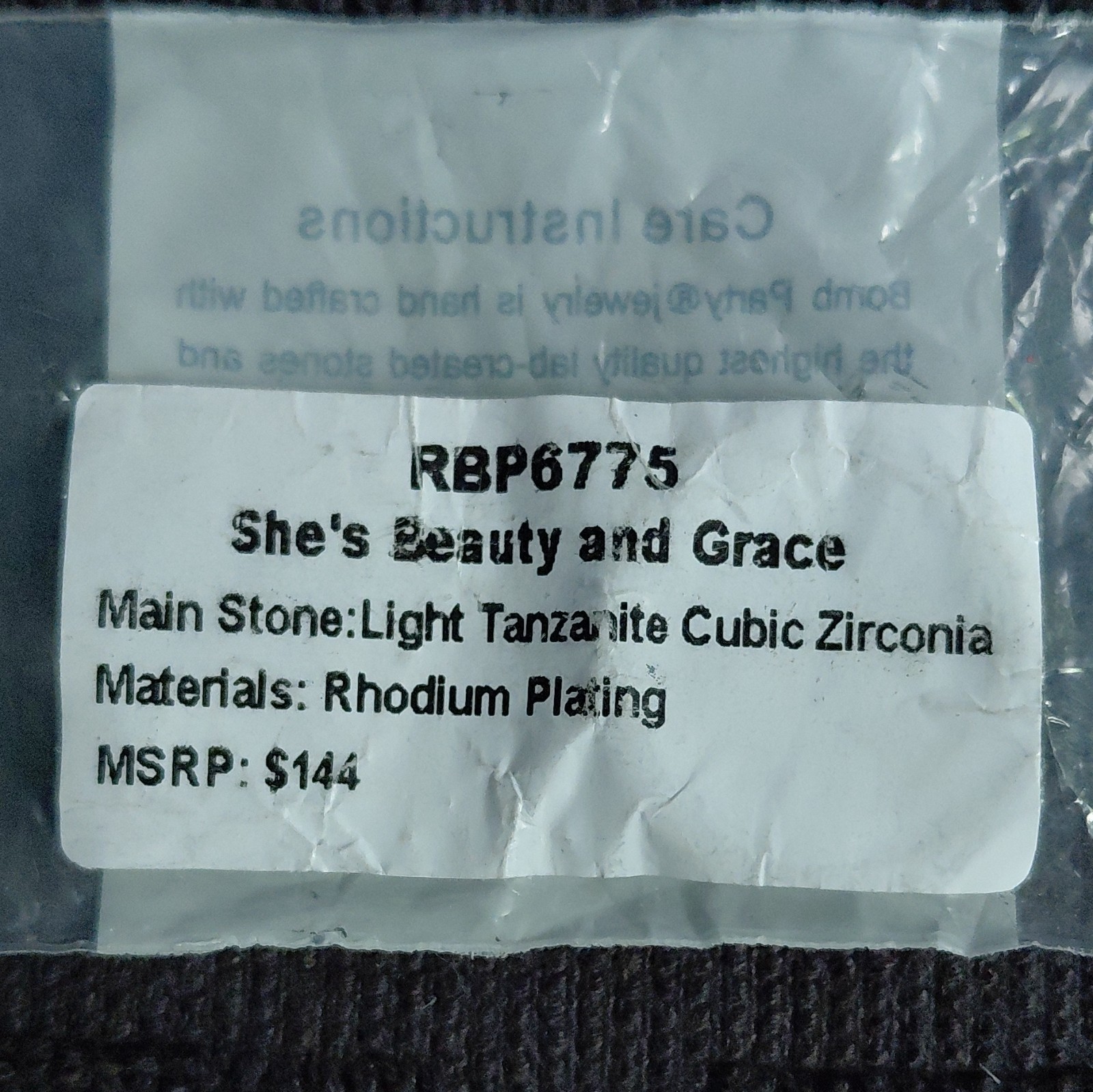 SHE’S BEAUTY AND GRACE- Rhodium CZ Pavé Band- BP-size 9- Dec Birthday 2023