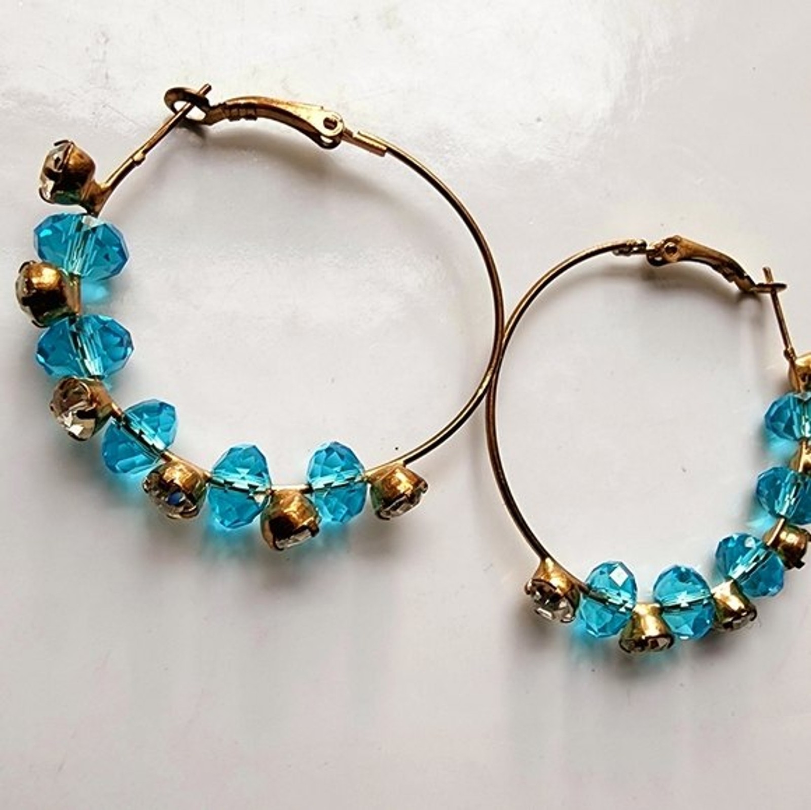 Large Bohemian wire rhinestone station hoops with brilliant blue stones