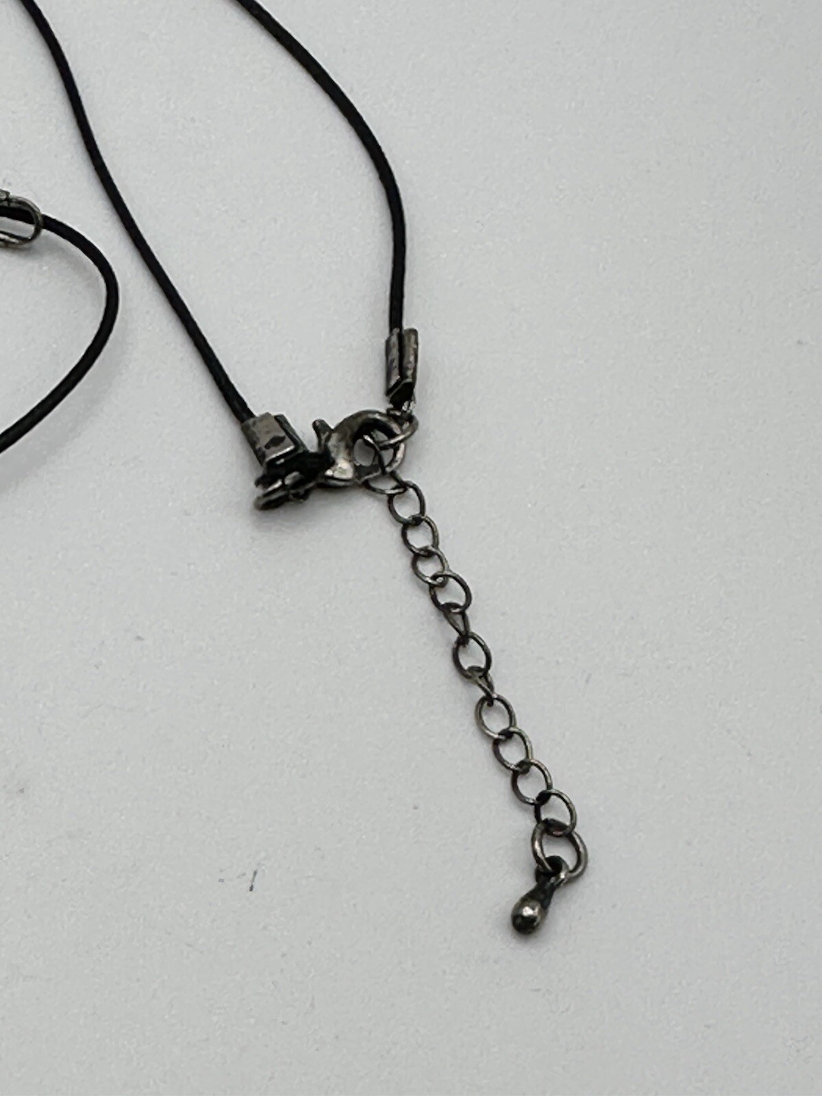 Six Segment Worry Fish Pendant On 24” Nylon Necklace With Lobster Clasp