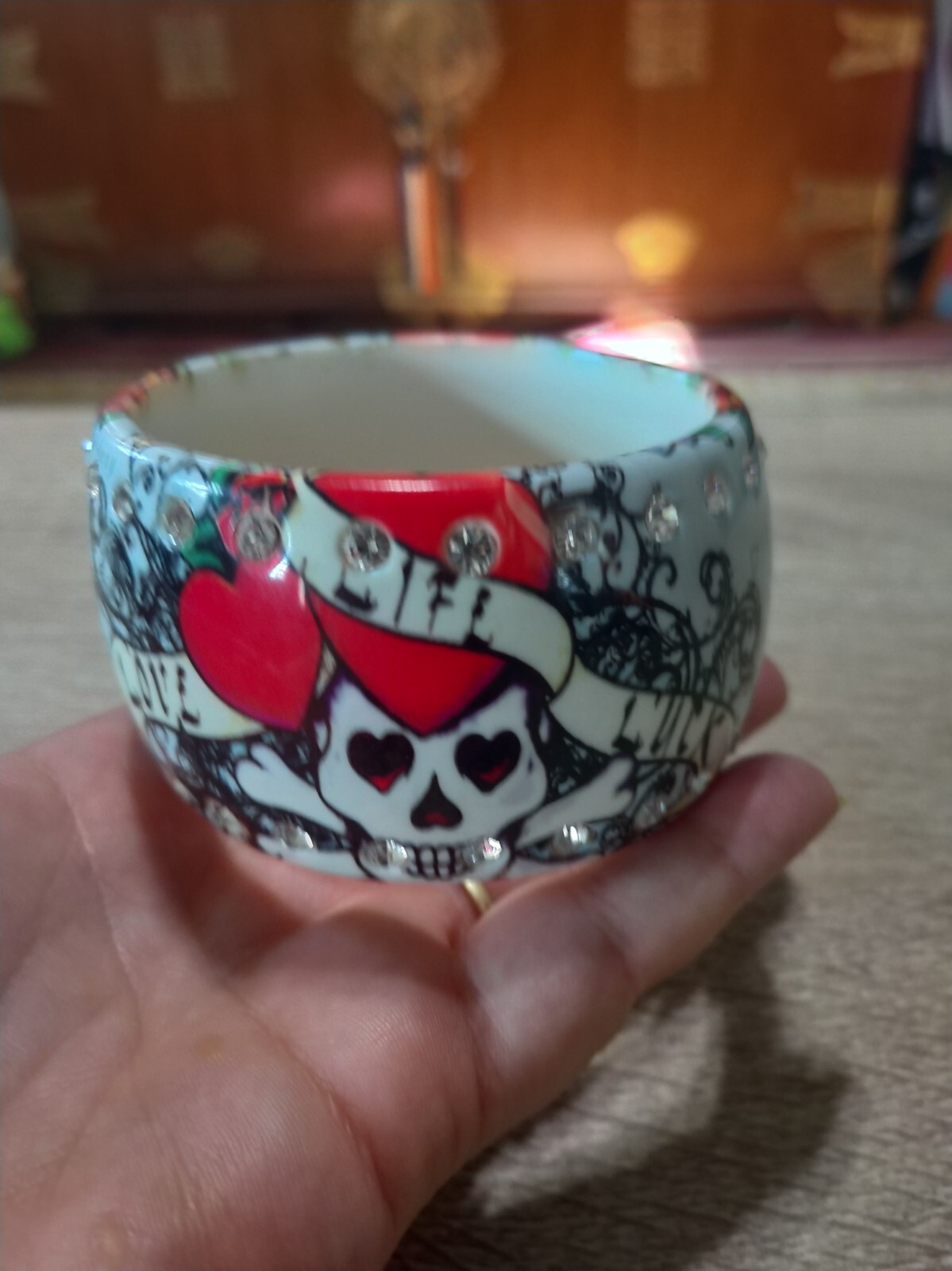Plastic, rhinestone bangle bracelet. Love life luck skeleton skull tattoo