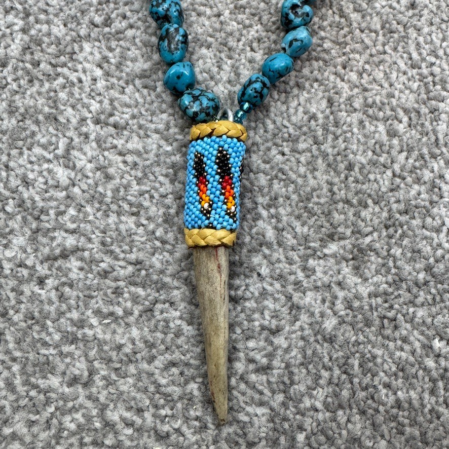 Handmade Necklace With Bone Pendant Wrapped In Beading On Blue Speckled Stones