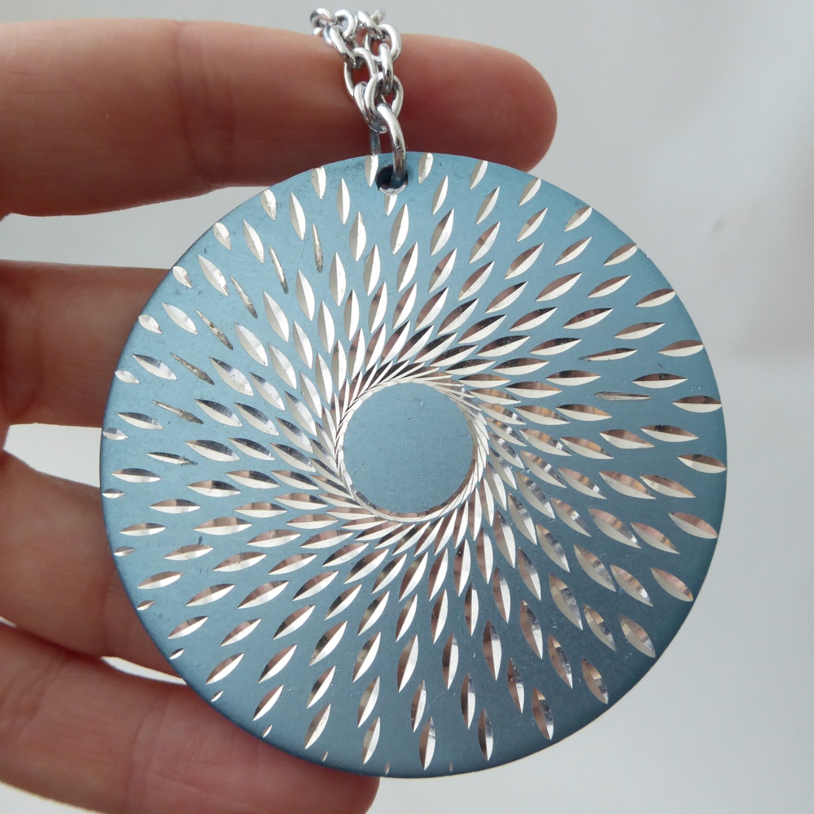 Conrah cristillium pendant necklace. Aluminium anodised blue metal. Geometric