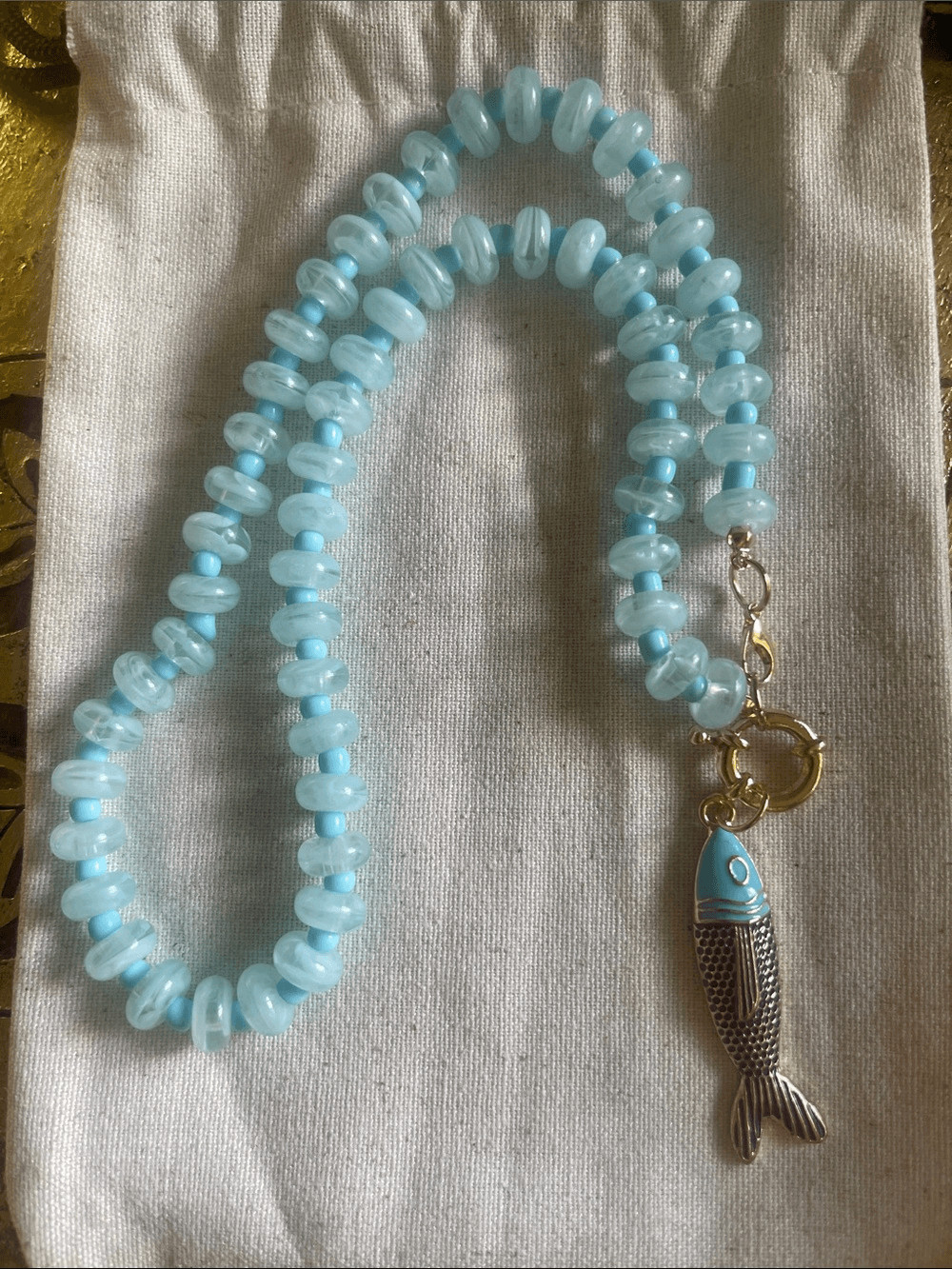 Light Blue Beaded Necklace with Fish Pendant