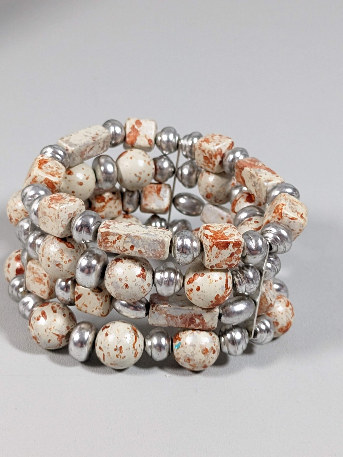 Silver Tone Ivory Color Brown Splatter Four Row Wide Stretch Bracelet 6 inches