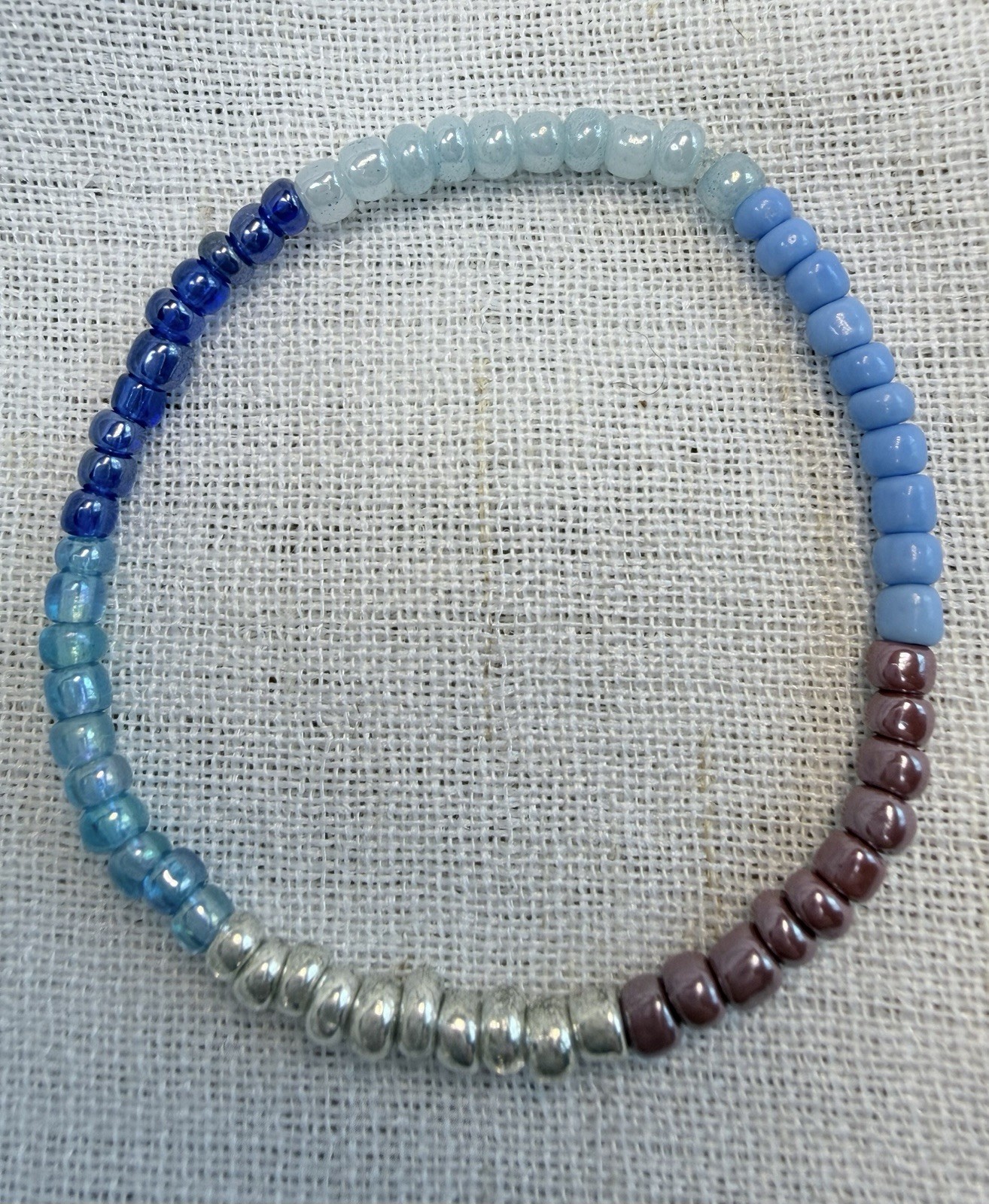 Boho bracelet set,light blue,silver,brown seed beads. Stretchy- 7.25” to 7.75”.